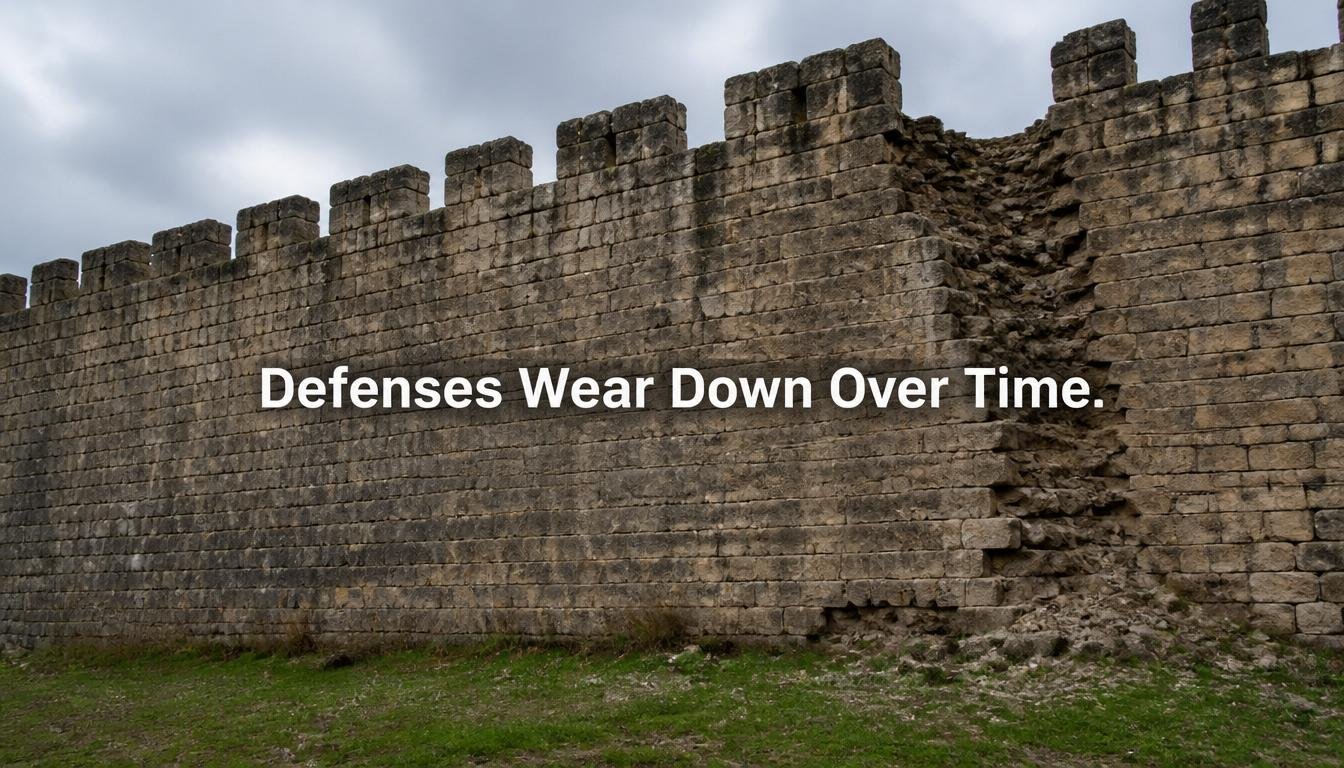 A castle wall shows one section more worn and crumbling than the rest.